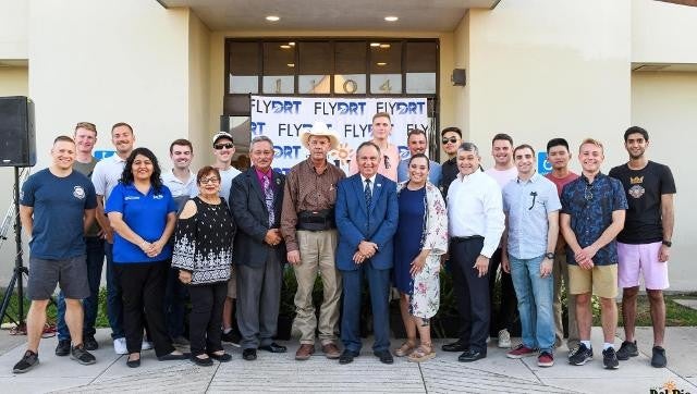 Smiling group posing together for a photo